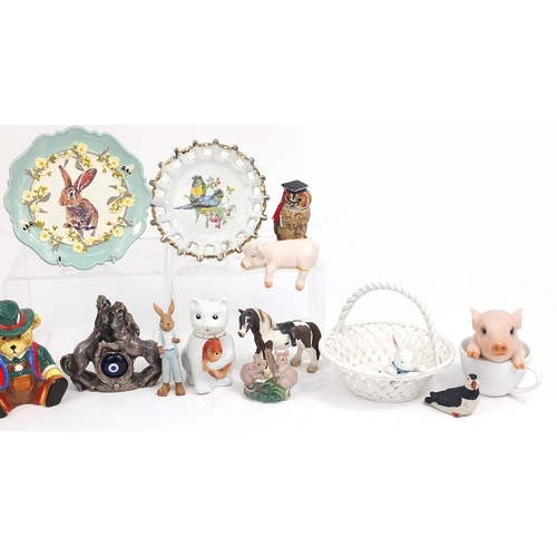 93 - Animal related ceramics and statues including teddy money box, rabbit plate, rabbit basket, cat teap... 