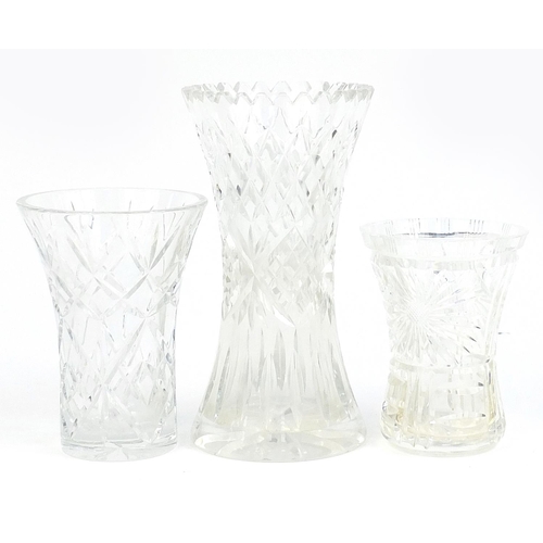 176 - Three crystal cut glass vases, the largest 25cm high