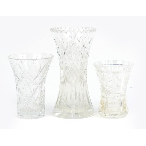 176 - Three crystal cut glass vases, the largest 25cm high