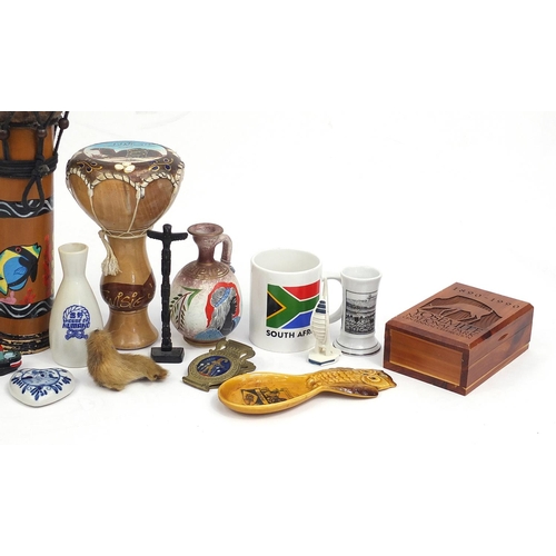 84 - Assorted souvenir items including British red telephone boxes, Greek pottery vase, tribal drum, Sout... 