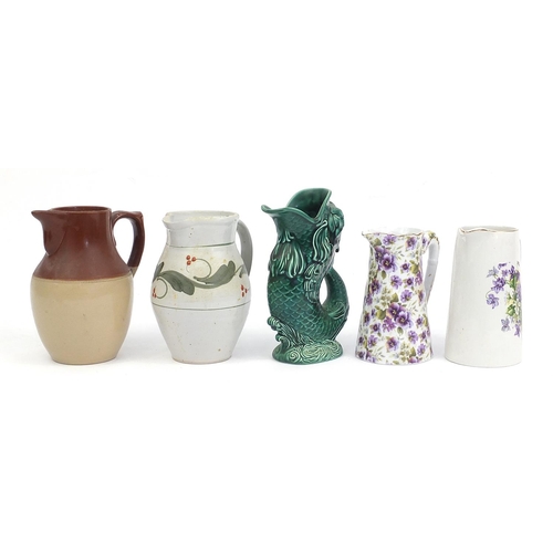 286 - Ceramic jugs including Wedgwood fish jug, violet design jug and studio pottery jug, the largest 22cm... 