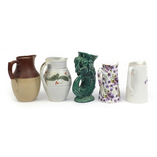 286 - Ceramic jugs including Wedgwood fish jug, violet design jug and studio pottery jug, the largest 22cm... 