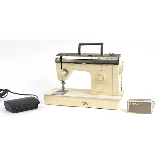 220 - Cased Singer electric sewing machine