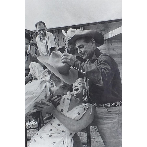 228 - Black and white print Marilyn Monroe and Clark Gable on film shoot, mounted in a black frame, overal... 