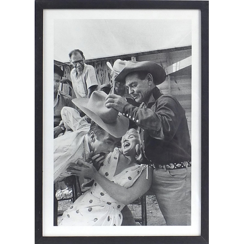 228 - Black and white print Marilyn Monroe and Clark Gable on film shoot, mounted in a black frame, overal... 