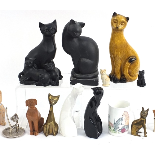 148 - Collectable cats and dogs including floral Staffordshire example, brass, mug etc,  the largest 25cm ... 