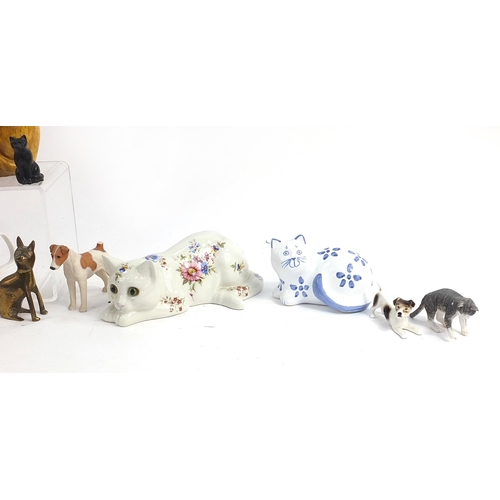 148 - Collectable cats and dogs including floral Staffordshire example, brass, mug etc,  the largest 25cm ... 