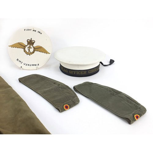 134 - Flag Officer Gibraltar naval hat, Fleet Air Arm wooden plaque, two khaki military hats and two kit b... 