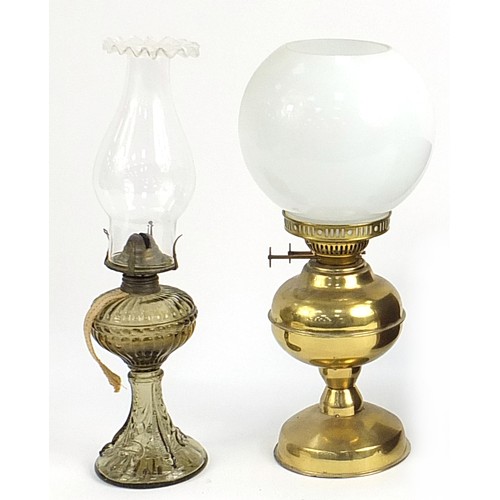 157 - Brass oil lamp with milk glass shade and a smoked glass oil lamp, the largest 35cm high