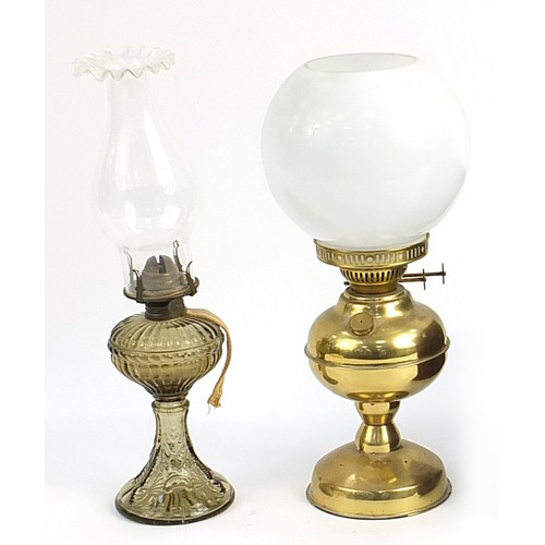 157 - Brass oil lamp with milk glass shade and a smoked glass oil lamp, the largest 35cm high