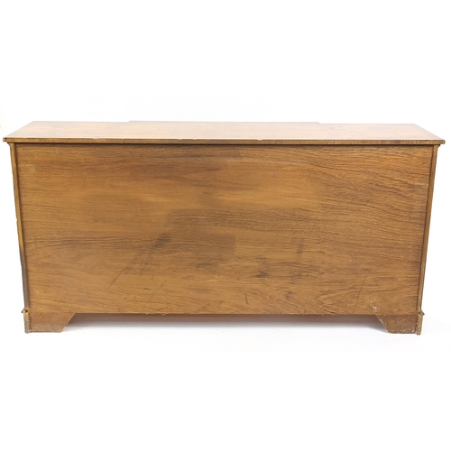 81 - Crossbanded yew breakfront sideboard with four drawers above four cupboard doors, 90cm H x 182cm W x... 