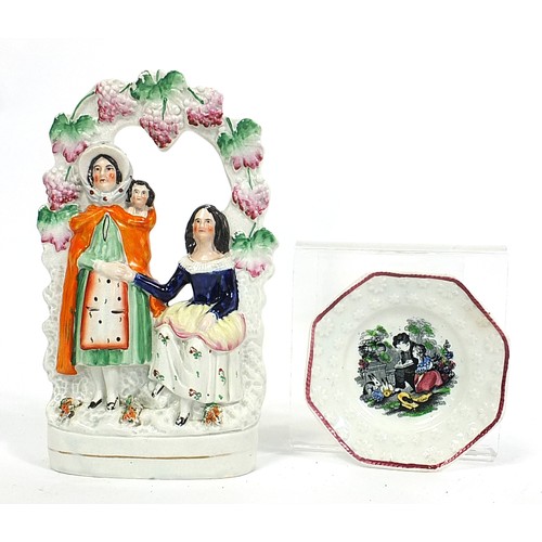 210 - Staffordshire figure and a Staffordshire childs plate, the largest 26cm high