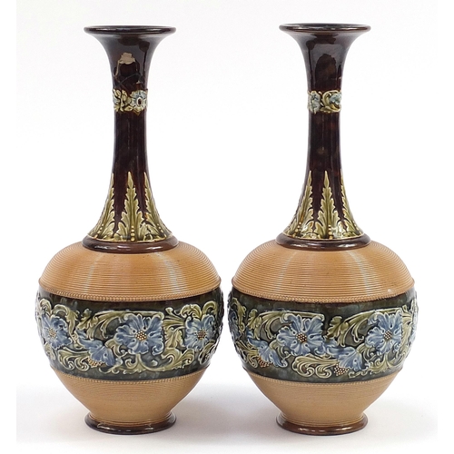 228 - Large pair of Doulton Lambeth stoneware vases hand painted with flowers, each 40.5cm high