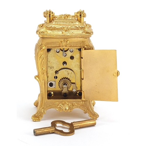 482 - Miniature gilt brass Rococo style carriage clock, 8cm high