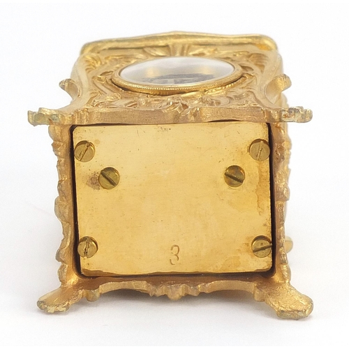 482 - Miniature gilt brass Rococo style carriage clock, 8cm high