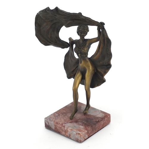 656 - Patinated bronze figurine of an Art Deco dancer with lift up skirt, raised on a square marble base, ... 