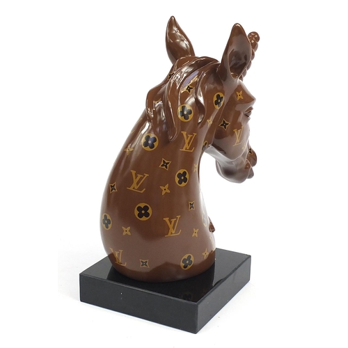 1056 - Louis Vuitton style bust of a unicorn raised on a square black slate base, 47cm high