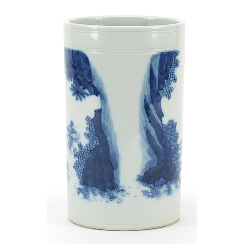 253 - Chinese blue and white porcelain brush pot hand painted with demons, 16.5cm high