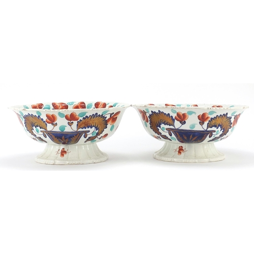 742 - Pair of Victorian ironstone centre bowls decorated with flowers and foliage, each 29cm in diameter