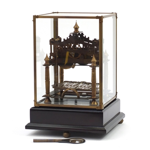 285 - Brass Congreve style rolling ball clock with three enamel dials housed in a glazed display case and ... 