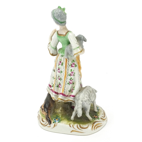 741 - Continental porcelain figure group of a lady with dog and lambs, 17.5cm high