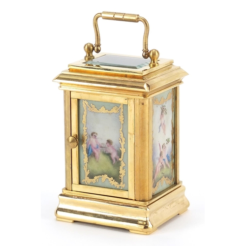 719 - Miniature brass cased carriage clock with Sevres style panels and swing handle, 8cm high