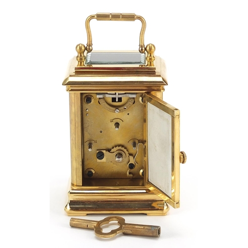 719 - Miniature brass cased carriage clock with Sevres style panels and swing handle, 8cm high