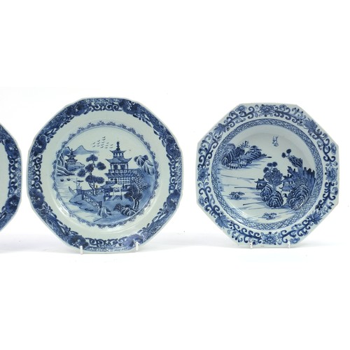 1138 - Four Chinese blue and white porcelain plates including a pair hand painted with pagodas in a river l... 