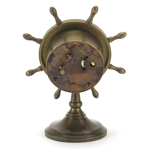 639 - Patinated bronze ship's wheel design clock with subsidiary dial, 15.5cm high