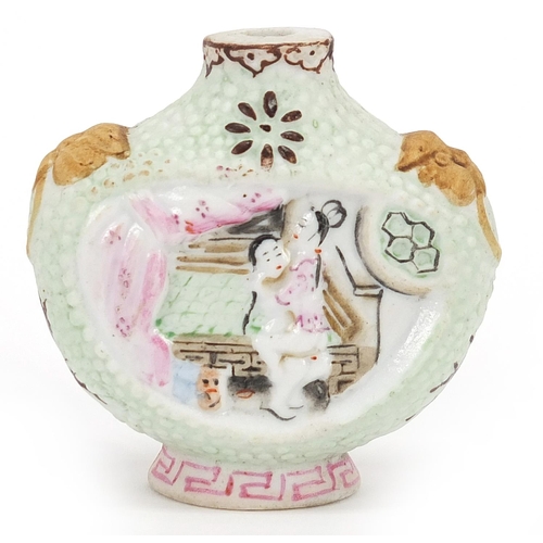 638 - Chinese porcelain snuff bottle decorated in relief with erotic scenes, 6cm high