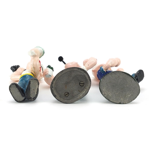 781 - Three painted cast iron figures of Popeye, the largest 16cm high