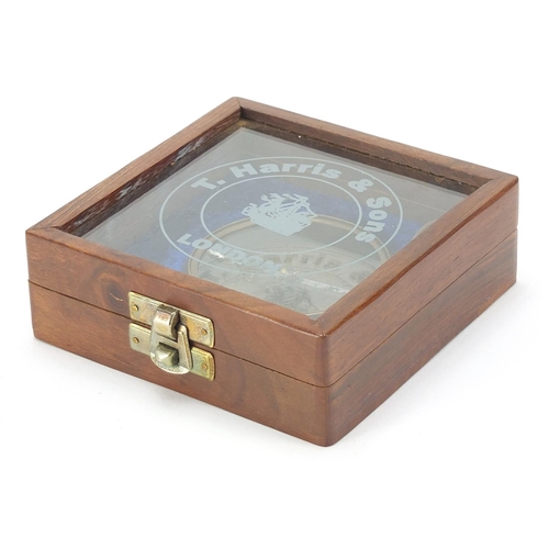 778 - Military interest brass sundial compass housed in a glazed hardwood case, 11cm wide