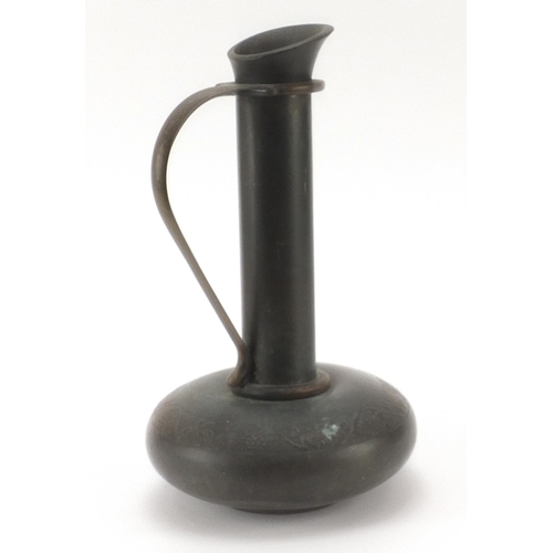 954 - Palbelle Co Ltd patinated metal handled jug decorated in low relief with flowers, 25cm high