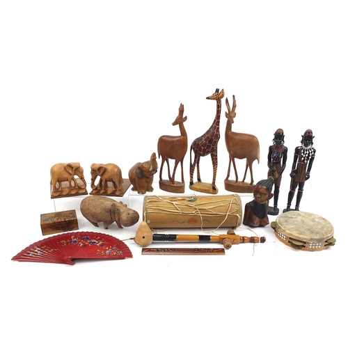 760 - Wooden items including African figures, animals, instruments and large carved wall mask, the largest... 