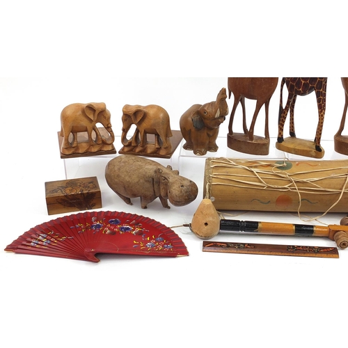 760 - Wooden items including African figures, animals, instruments and large carved wall mask, the largest... 