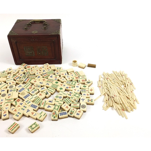 1484 - Chinese bone and bamboo Mahjong set housed in a hardwood case with brass mounts, the case 15.5cm H x... 