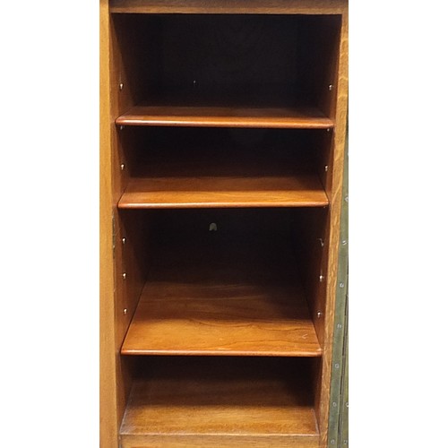 840 - Manner of Heals, Art Deco oak desk with lift of glass top and two doors enclosing drawers and shelf ... 