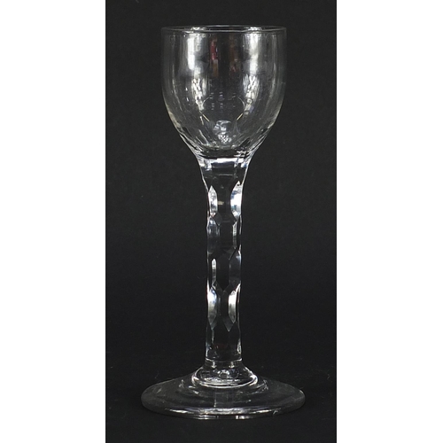 43 - 18th century wine glass with facetted stem, 15.5cm high