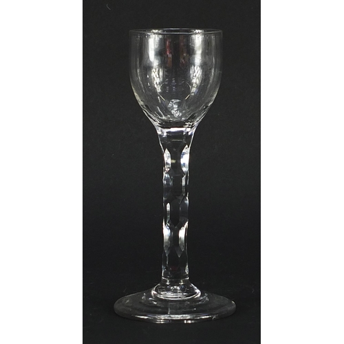 43 - 18th century wine glass with facetted stem, 15.5cm high