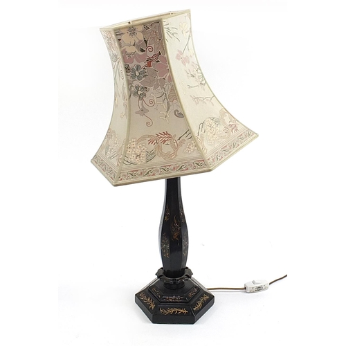 574 - Black lacquered wooden table lamp with mother of pearl inlay and shade, 82cm high