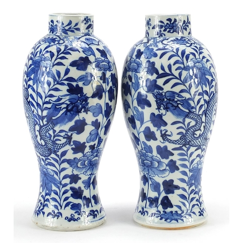 57 - Pair of Chinese blue and white porcelain baluster vases hand painted with dragons amongst flowers, b... 