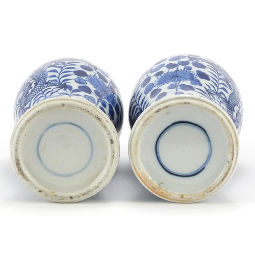 57 - Pair of Chinese blue and white porcelain baluster vases hand painted with dragons amongst flowers, b... 