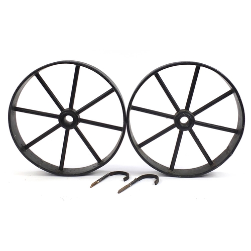 1070 - Pair of antique cast iron wheels, 53cm in diameter