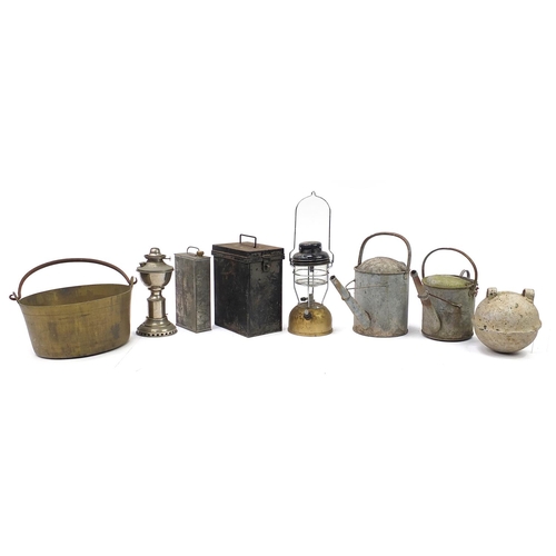 1066 - Metalware including The Kranzow lamp, heavy brass preserve pan and watering cans, the largest 39cm i... 