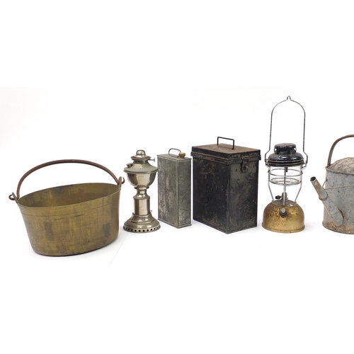 1066 - Metalware including The Kranzow lamp, heavy brass preserve pan and watering cans, the largest 39cm i... 