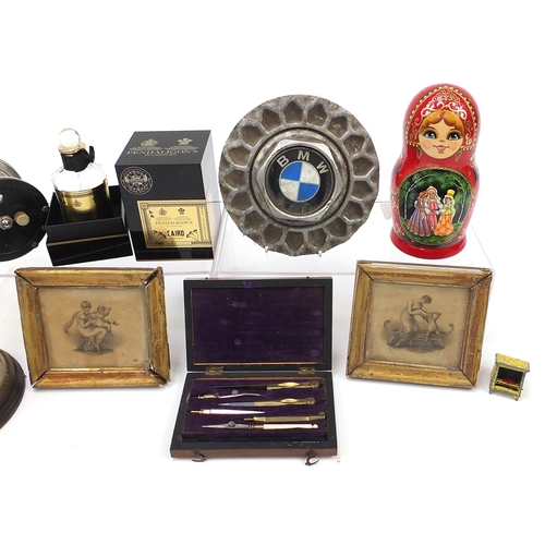 1019 - Sundry items including set of Russian stacking dolls, vintage fishing reel and BMW vehicle hub cap