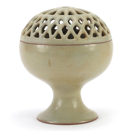 434 - Chinese porcelain pedestal bowl with pierced cover having a celadon glaze, 15.5cm high