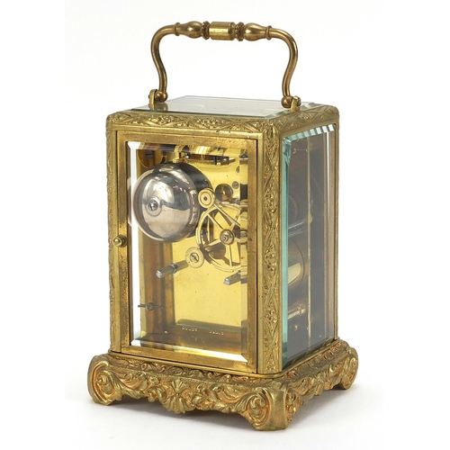 11 - 19th century gilt brass cased carriage clock striking on a bell with enamelled dial having Roman num... 