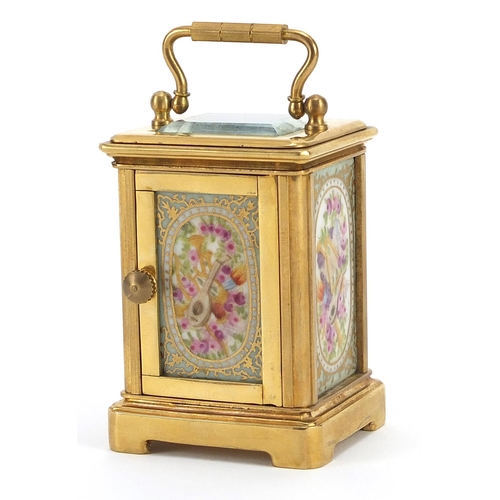 806 - Miniature brass cased carriage clock with Sevres style panels and swing handle, 7.5cm high