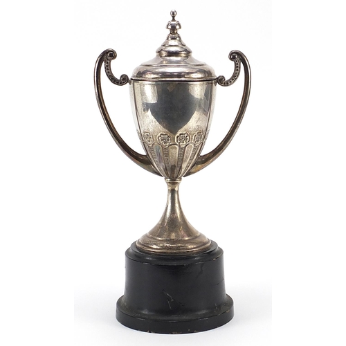 2222 - Spanish silver chivalry interest trophy with twin handles and cover raised on a wooden base, 35cm hi... 